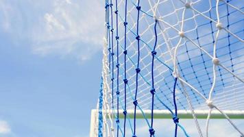 Behind the ropes of the outdoor soccer field goal net, Background for use in video production