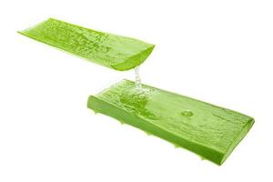 Fresh sliced aloe vera showing juicy liquid gel inside isolated over white. photo