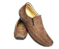 Pair of new brown leather fashion shoe for man isolated over white photo