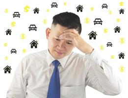Business man is thinking seriously about his house and car financial problem with icons overlay photo