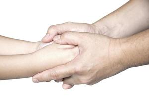 Father gentle holding son's hand over white background - people love help care each other concept photo