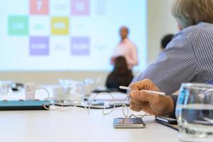 close up on the table of Attendances pay attention for listen the speaker about digital transformation and disruptive technology. photo