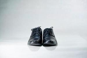 Luxuary man leather black shoe on the white isolation backtground. photo