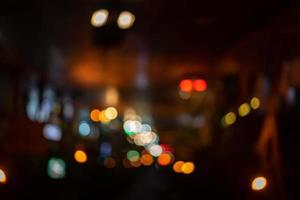 Abstract night bokeh from Thailand midnight street in dark and orange red tungsten mood and tone theme. photo