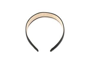 Isolated Black hair band headband in the stuido light with white background. photo