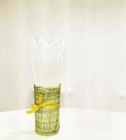 Napkin tissue paper in the small decorated container in a restaurant photo