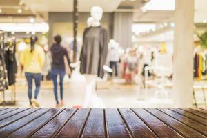 Brown wooden planks over blurred superstore background photo