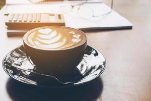 Office working item with coffee cup over wooden top table photo