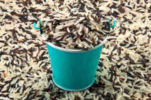 Rice bucket on white background photo