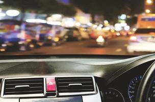 Front view of car looking out from inside with twilight road background photo