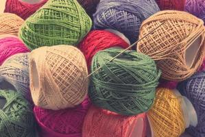 Bright colored yarn balls background photo