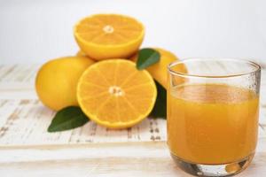 Fresh orange juice fruit drink glass over white background - tropical orange fruit for background use photo