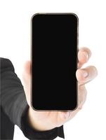 A business man is showing blank mobile phone screen. Photo is isolated over white and included clipping path.