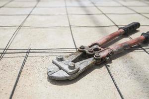 Steel cutting pliers, construction hand tool background photo