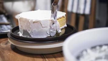 Lady making cream cake - people with homemade bakery concept photo