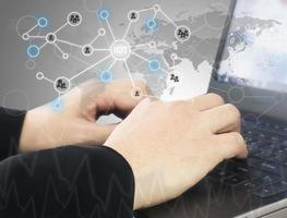 Business man is typing keyboard computer working with his worldwide business, internet financial technology fintech concept.ter photo