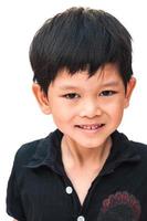 Portrait of smiling boy over white background photo