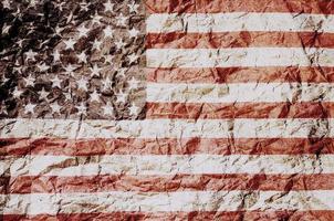 USA flag overlay on brown tone crumpled paper abstract background photo
