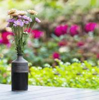 Fresh colorful flower in a small ceramic pot - colorful flower decoration pot for background use concept photo