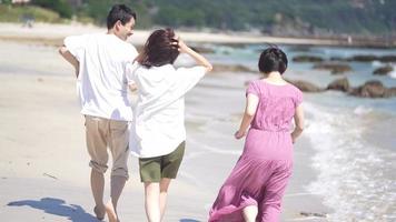 Men and women running along the coast video