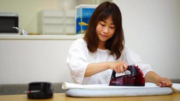 Woman ironing clothes video