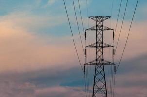 High voltage power transmission tower in twilight photo