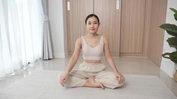 girl warming up exercise on exercise mat at home video