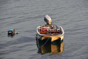 Tri Hull Whaler Boat Tied on a Mooring photo