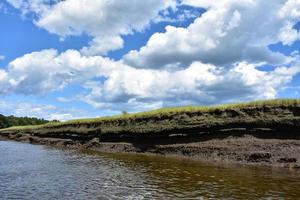 Fluffy White Clouds on a Spring Day Over North River photo