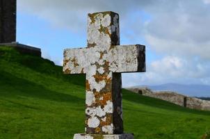 Old Stone Cross with Lichen on It photo