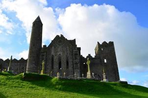 White Fluffy Clouds Over the Rock of Cashel photo