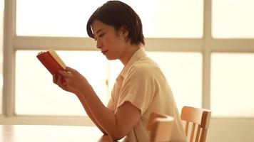 Image of a woman reading video