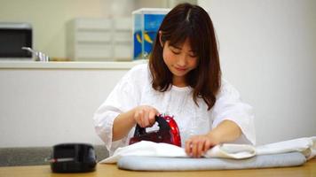 Woman ironing clothes video