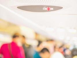 Blurred photo of walking passengers in an commercial airplane