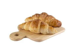 croissant recipe on wooden plate isolated over white background photo