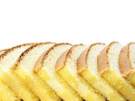 Row of inclined sliced butter cakes isolated over white photo