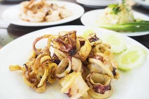 Grilled squid served in white dish ready to eat photo