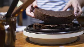 Lady making chocolate cake - people with home made bakery concept photo