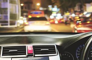 Front view of car looking out from inside with twilight road background photo