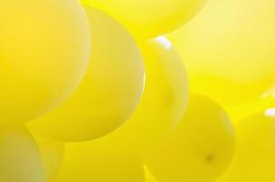 Yellow balloon in sunlight for background use photo