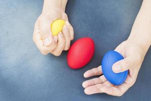 Soft rugby ball in hand for hand and finger exerciser photo