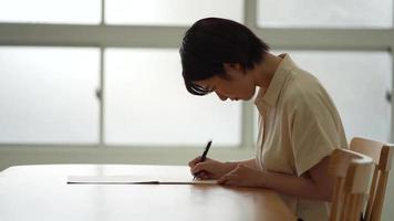 A woman practicing a brush pen video