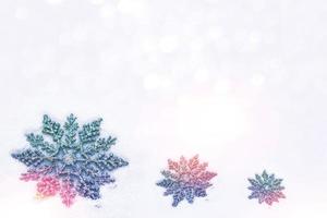 White fluffy snowflakes on snow. Winter christmas background. photo