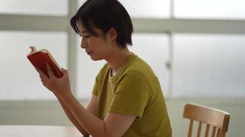 Image of a woman reading video