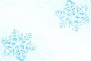 White fluffy snowflakes on snow. Winter christmas background. photo