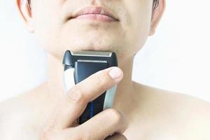 Man is using shaver photo