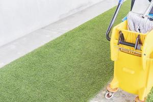 Cleaning equipment cart in hotel green corridor photo