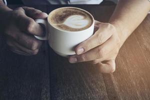 Vintage coffee with Latte art decoration photo