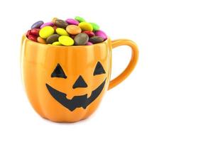 Halloween candiesHalloween candies cup isolated over white photo