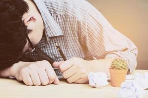 Man sleeping after working seriously photo